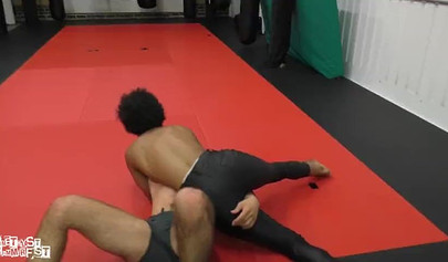 Athletic ebony babe wrestles topless with a white guy and subdues him erotically