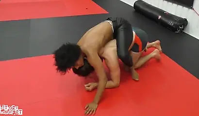 Athletic ebony babe wrestles topless with a white guy and subdues him erotically