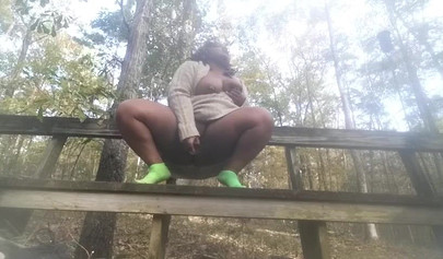 Chubby black amateur shows off her big tits and ass and rides a dildo outside