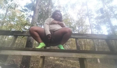 Chubby black amateur shows off her big tits and ass and rides a dildo outside