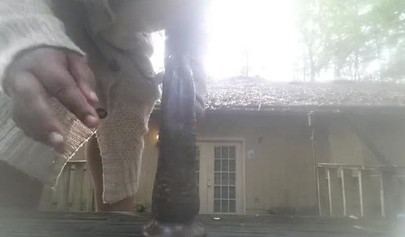 Chubby black amateur shows off her big tits and ass and rides a dildo outside