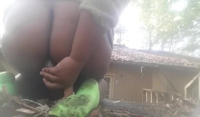 Chubby black amateur shows off her big tits and ass and rides a dildo outside