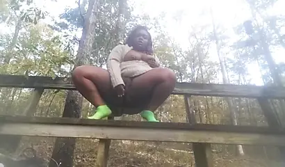 Chubby black amateur shows off her big tits and ass and rides a dildo outside