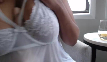 Sensual black girl with an amazing body uses dildo to tease her perfect breasts