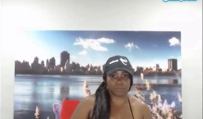 Black chick with a massive ass enjoys toys in her pussy while rubbing her clit