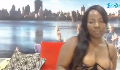 Black chick with a massive ass enjoys toys in her pussy while rubbing her clit