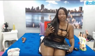 Black chick with a massive ass enjoys toys in her pussy while rubbing her clit