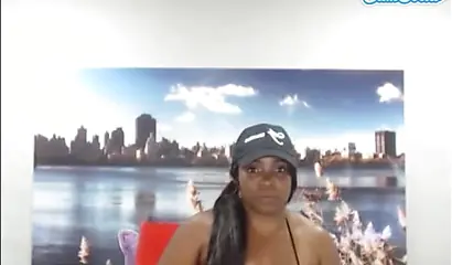 Black chick with a massive ass enjoys toys in her pussy while rubbing her clit