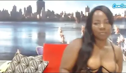 Black chick with a massive ass enjoys toys in her pussy while rubbing her clit