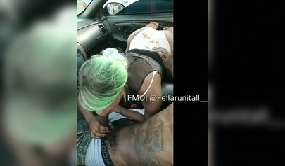 Black cutie gives dude an amazing blowjob in the parking lot and moans as well