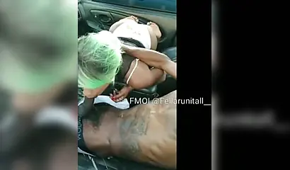 Black cutie gives dude an amazing blowjob in the parking lot and moans as well
