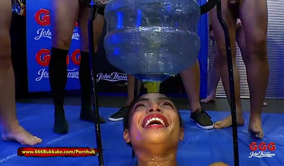 Ebony Luna Corazon sucks dicks and earns a sexy reward made of piss and cum