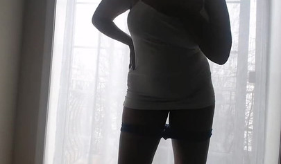 Ebony girl in white clothes slowly strips in front of the curtain and loves it