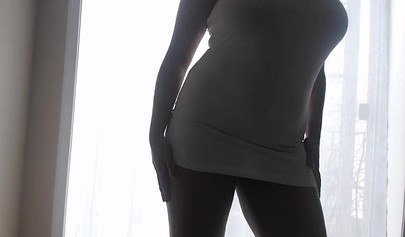 Ebony girl in white clothes slowly strips in front of the curtain and loves it