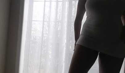 Ebony girl in white clothes slowly strips in front of the curtain and loves it
