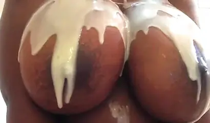 Kinky black MILF washes her gigantic tits and gives you jerk off instructions