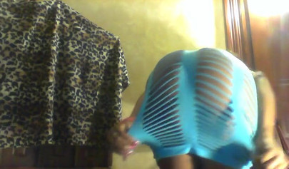 Sexy black girl in a blue dress shakes her fat ass and strips in her cam show