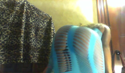 Sexy black girl in a blue dress shakes her fat ass and strips in her cam show