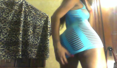 Sexy black girl in a blue dress shakes her fat ass and strips in her cam show