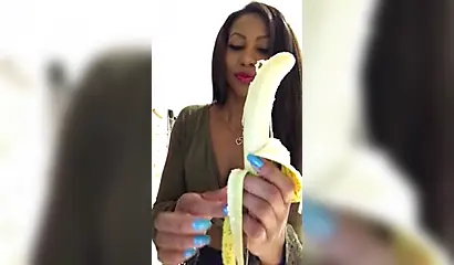 ASMR video of a beautiful black babe sensually and seductively eating a banana