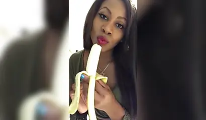ASMR video of a beautiful black babe sensually and seductively eating a banana