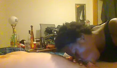 Curly ebony amateur gives a long and sloppy blowjob and deepthroat to a white cock