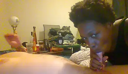 Curly ebony amateur gives a long and sloppy blowjob and deepthroat to a white cock