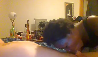 Curly ebony amateur gives a long and sloppy blowjob and deepthroat to a white cock