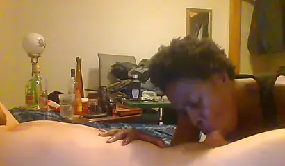 Curly ebony amateur gives a long and sloppy blowjob and deepthroat to a white cock