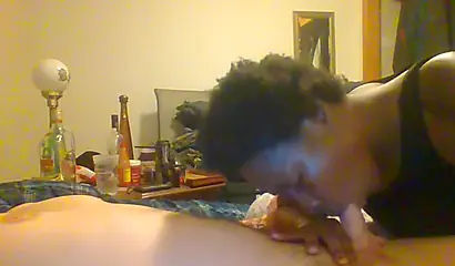 Curly ebony amateur gives a long and sloppy blowjob and deepthroat to a white cock