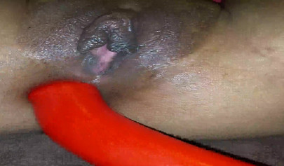 Horny ebony amateur girl gives an erotic performance by dildoing both of her holes