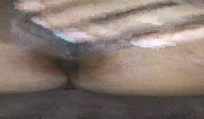 Horny ebony amateur girl gives an erotic performance by dildoing both of her holes