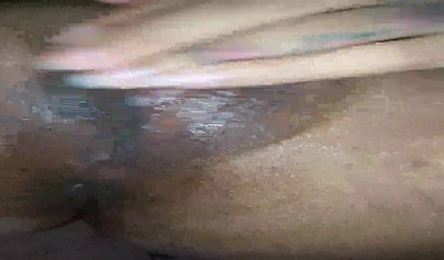 Horny ebony amateur girl gives an erotic performance by dildoing both of her holes