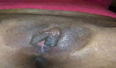 Horny ebony amateur girl gives an erotic performance by dildoing both of her holes