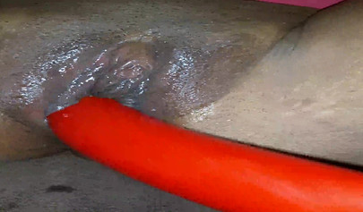 Horny ebony amateur girl gives an erotic performance by dildoing both of her holes