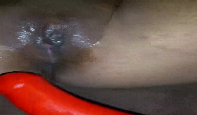 Horny ebony amateur girl gives an erotic performance by dildoing both of her holes