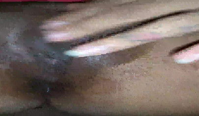 Horny ebony amateur girl gives an erotic performance by dildoing both of her holes