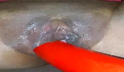 Horny ebony amateur girl gives an erotic performance by dildoing both of her holes