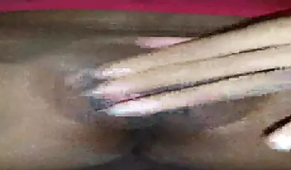 Horny ebony amateur girl gives an erotic performance by dildoing both of her holes