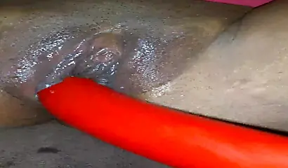 Horny ebony amateur girl gives an erotic performance by dildoing both of her holes