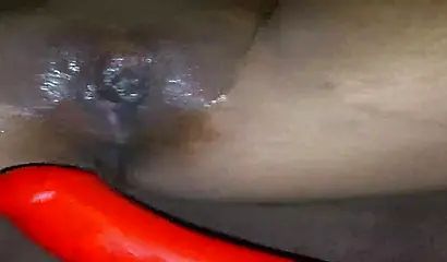 Horny ebony amateur girl gives an erotic performance by dildoing both of her holes