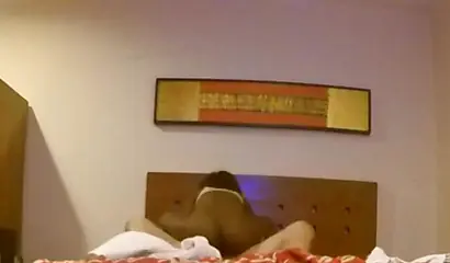 Curly black chick swallows a hard white dick before having her pussy hammered