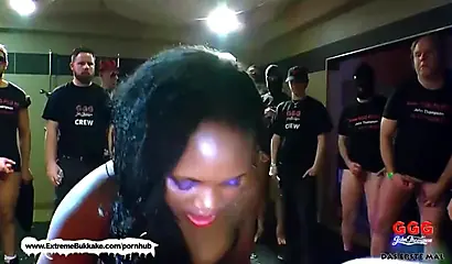 Lusty ebony enjoys sucking and riding multiple cocks before being sprayed with cum