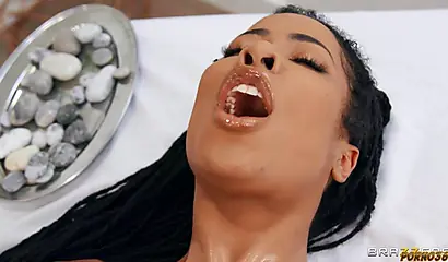 Slutty ebony is getting her ass fucked by a white masseur