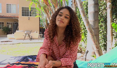 Adorable ebony is riding a huge white cock by the pool