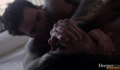 Seductive ebony enjoying interracial sex with a tattooed dude