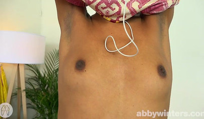 Petite ebony girl is playing with her hairy twat