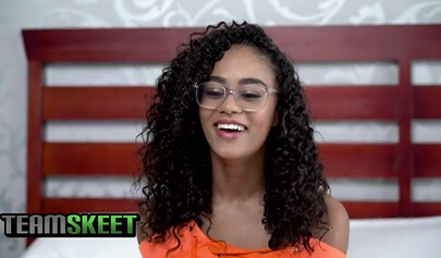 Curly-haired ebony in glasses gets fucked in a doggystyle position