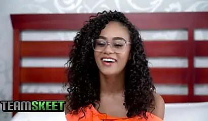 Curly-haired ebony in glasses gets fucked in a doggystyle position