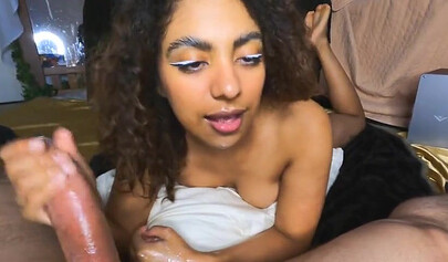 Curly-haired ebony stepdaughter is sucking a huge daddy's cock